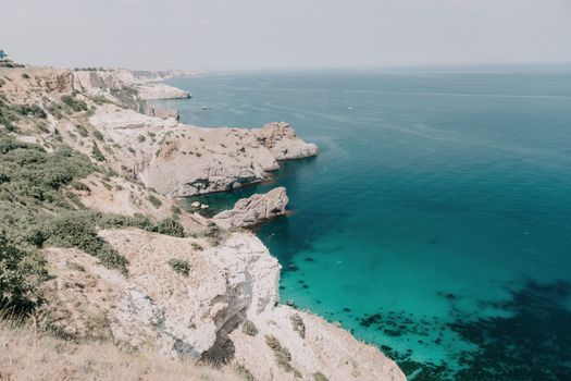 Aerial panoramic view of beautiful sunset above sea. Beautiful seascape. Sun glare, small waves on the water surface. Evening. Horizon. Nobody. No people. Copy space. Never-ending beauty of nature