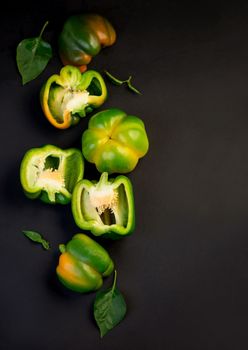 sweet pepper, green bell pepper on black background