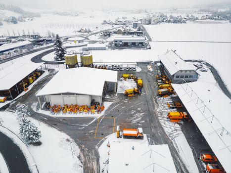 Highway maintenance job base in the middle of winter on a snowy day. Snow causing problems and delays on the highway.