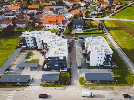 Drone view, aerial shoot of new build houses in the suburbs of Slovenia, somewhere in the country side, Europe. New modern houses, family homes.