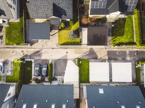 Drone view, aerial shoot of new build houses in the suburbs of Slovenia, somewhere in the country side, Europe. New modern houses, family homes.