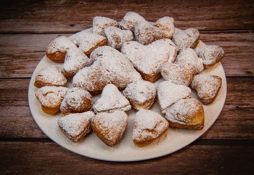 Recipe for soft heart-shaped doughnuts for Valentine's Day. High quality photo