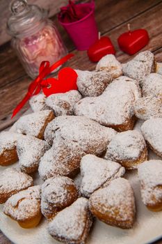Recipe for soft heart-shaped doughnuts for Valentine's Day. High quality photo