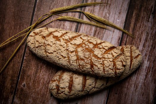 Rye bread on brown background. High quality photo