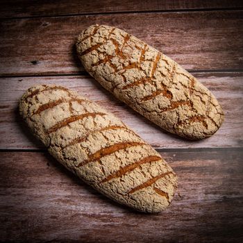 Rye bread on brown background. High quality photo