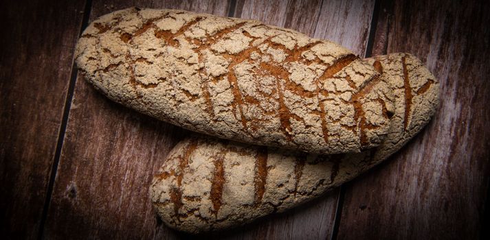 Rye bread on brown background. High quality photo