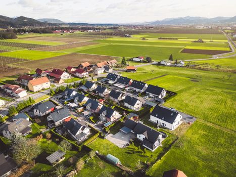 Drone view, aerial shoot of new build houses in the suburbs of Slovenia, somewhere in the country side, Europe. New modern houses, family homes.