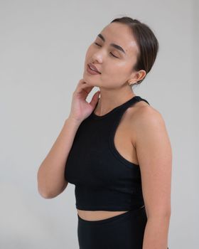 Portrait of a smiling Asian woman on a white background