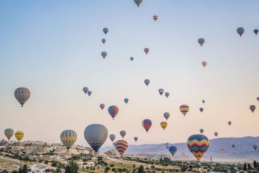 Colorful hot air balloon flying over Cappadocia, Turkey.