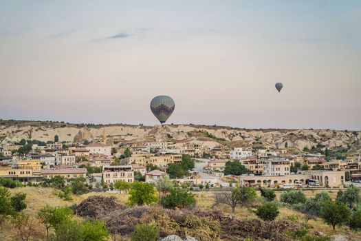 Colorful hot air balloon flying over Cappadocia, Turkey.