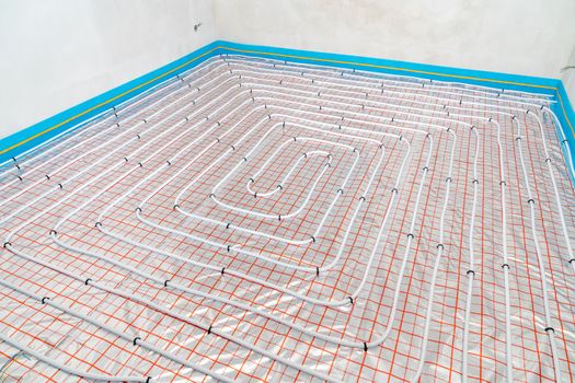 underfloor heating in the room on the construction site.