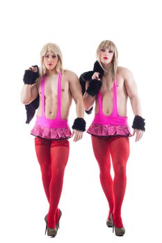 Portrait of transvestites in pink costumes. Isolated on white