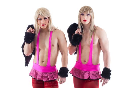 Portrait of transvestites in pink costumes. Isolated on white