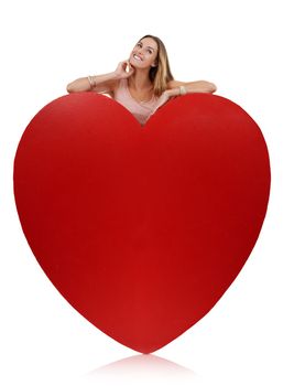 Heart, in love and woman happy with freedom and funny excited feeling behind sign. Model, white background and comic young person with happiness, joy and smile for romance and beauty isolated.