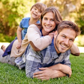 Family day is always fun. Portrait of a loving family spending the day outdoors