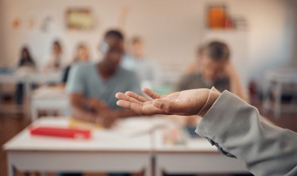 Hand, education and study with a teacher and students in a classroom for a lesson on growth or development. University, learning and higher education with an educator explaining a theory in a class.