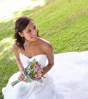 Sweet and romantic bridal style. Gorgeous young bride outdoors in her wedding dress