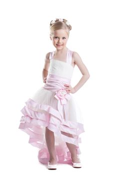 Full length portrait of pretty little girl in beautiful dress. Isolated on white