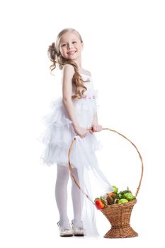 Full length portrait of happy little girl with fruits. Isolated on white