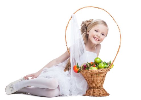 Full length portrait of happy and pretty little girl with fruits. Isolated on white