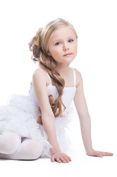 Beautiful girl in white dress posing in studio, on white background