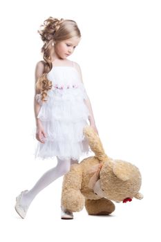 Lovely little girl with plush toy isolated on white