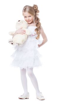 Lovely smiling girl with white teddy bear, isolated on white
