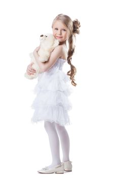 Full length portrait of pretty little girl with soft toy. Isolated on white