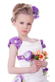 Pretty little girl with bouquet. Isolated on white