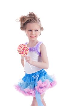 Beautiful little girl with lollipop. Isolated on white