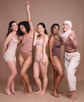 Beauty, natural and diversity with woman friends together in studio on a brown background to promote real body positivity. Health, wellness and luxury with a female group posing for self love.