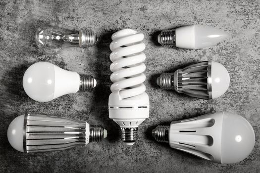 Top view on different electric lamps with different technology - different led, luminescent and incandescent lamp.