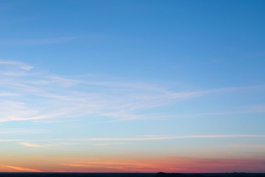 Minimal artistic colorful sunset sky background with horizon line.