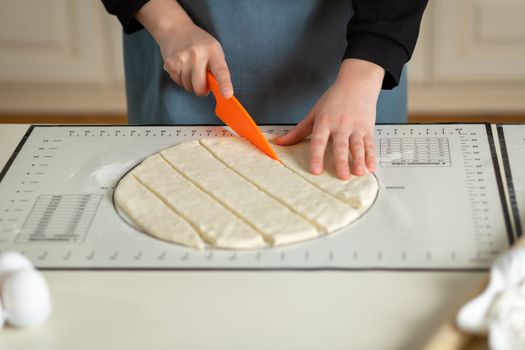 Using the kitchen silicone baking mat with markings and tips in the process of cooking in the kitchen with copy space.