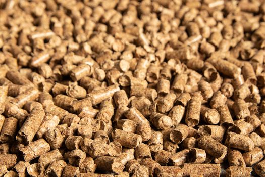 Toilets for pets, wood filler in the form of small compressed pellets background.