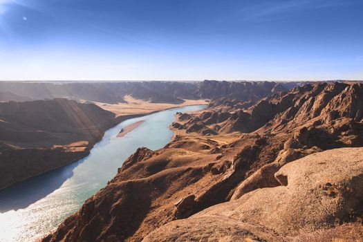 River view in rocky gorge terrain, middle asian nature landscape.