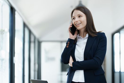 business owner or Asian female marketers are using business phones in office work.