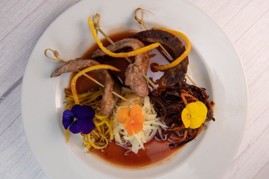 Recipe for duck aiguillettes with three-coloured turnips and orange caramel port sauce, High quality photo