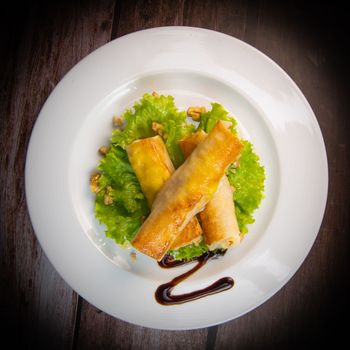 Brick recipe with goat cheese and honey in the oven with a walnut salad. High quality photo