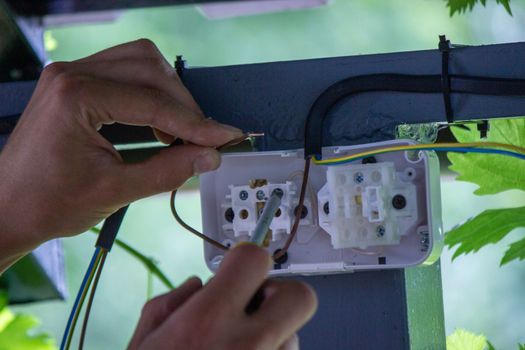 electrician to connect the outlet. selective focus