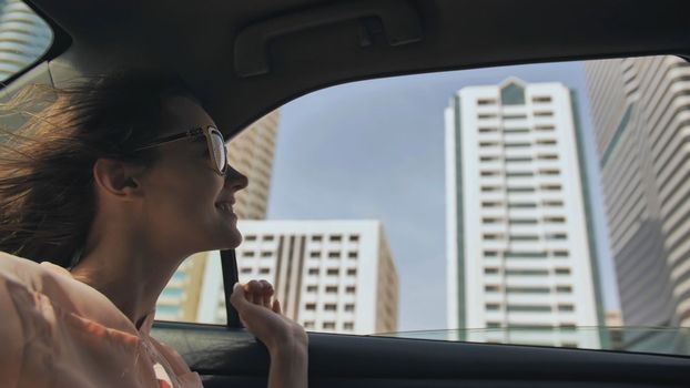 Happy Girl driving a car in Dubai