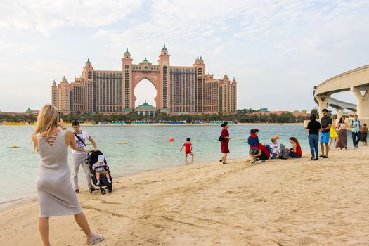Beach with tourists on the background of the Atlantis hotel