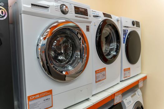 Sosnovy Bor, RUSSIA - JANUARY 12, 2023: household appliances in DNS store, washing machines. High quality photo