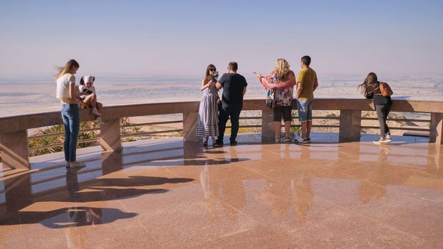 Top with tourists near the city of Al Ain in the United Arab Emirates