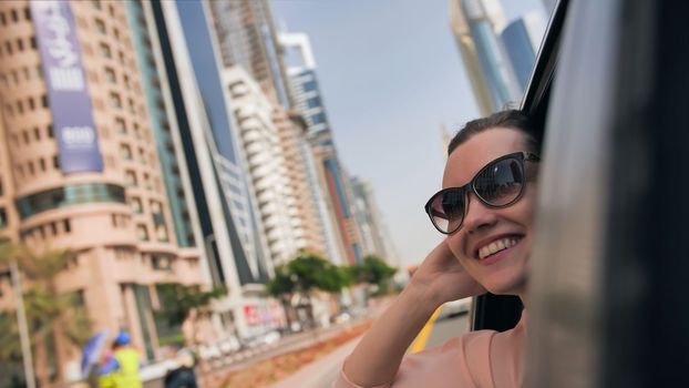 Happy Girl driving a car in Dubai