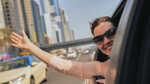 Happy Girl driving a car in Dubai