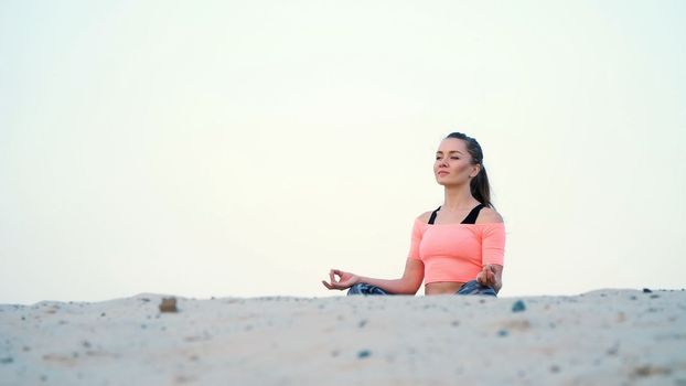 healthy yoga woman meditation at sunrise seaside. High quality photo