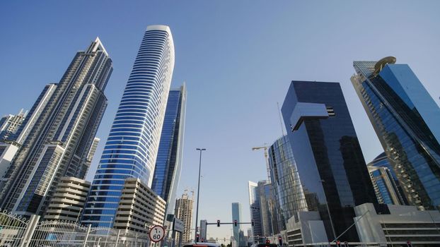 Tall and modern skyscrapers of Dubai on a sunny day
