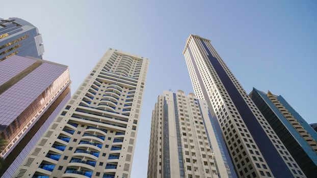 Tall and modern skyscrapers of Dubai on a sunny day