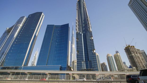 Tall and modern skyscrapers of Dubai on a sunny day